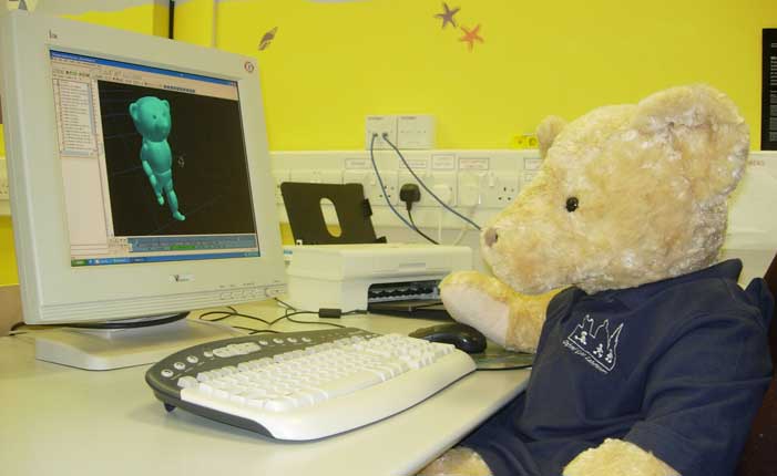 Gait Lab - a teddy bear using a computer