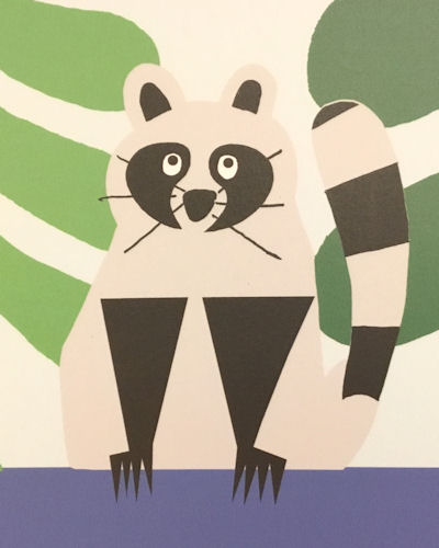 A close up of a raccoon image from a mural