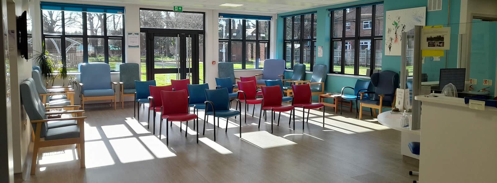 Rows of chairs in sunny waiting room