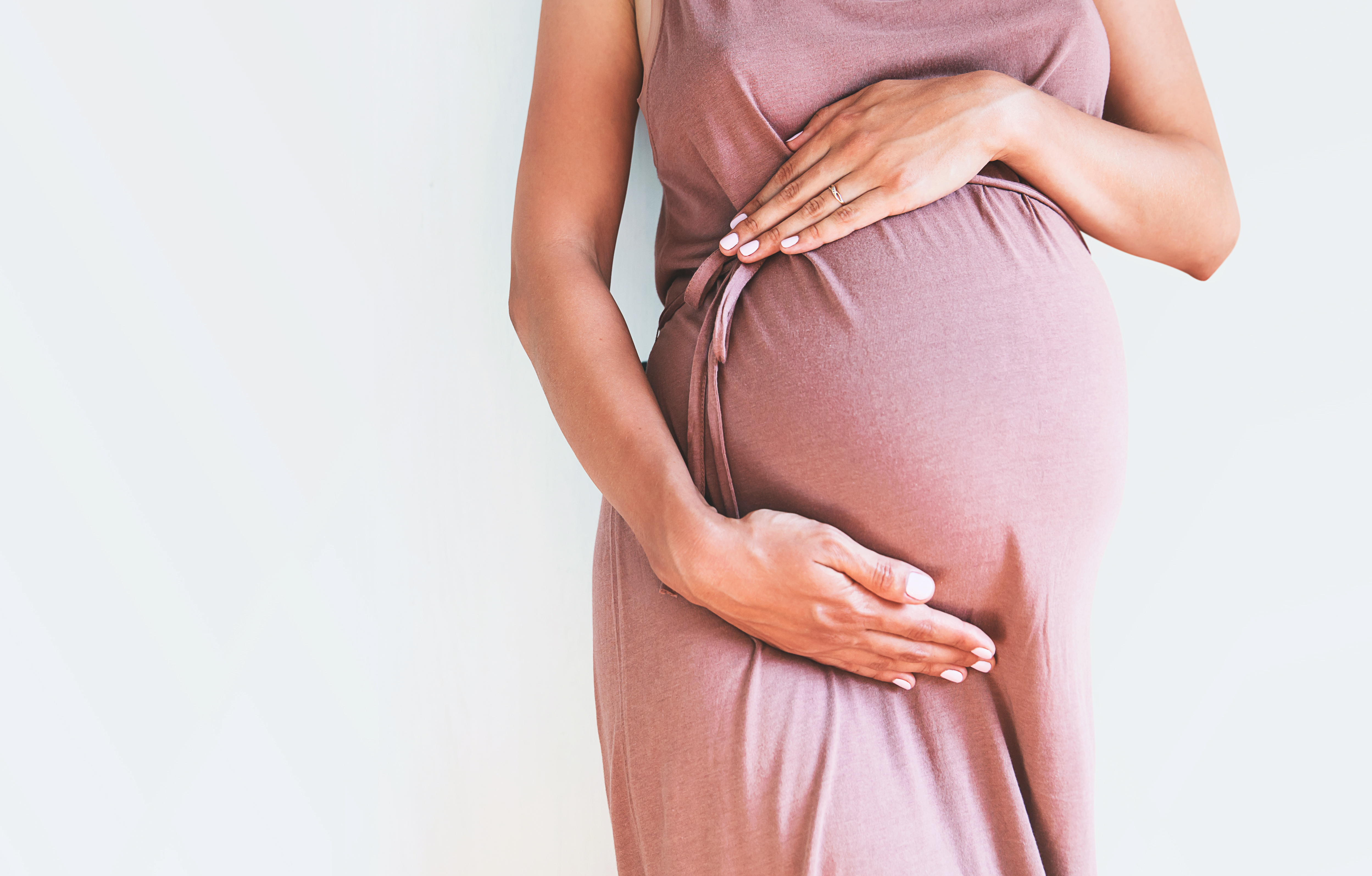 pregnant woman holding her 'bump'