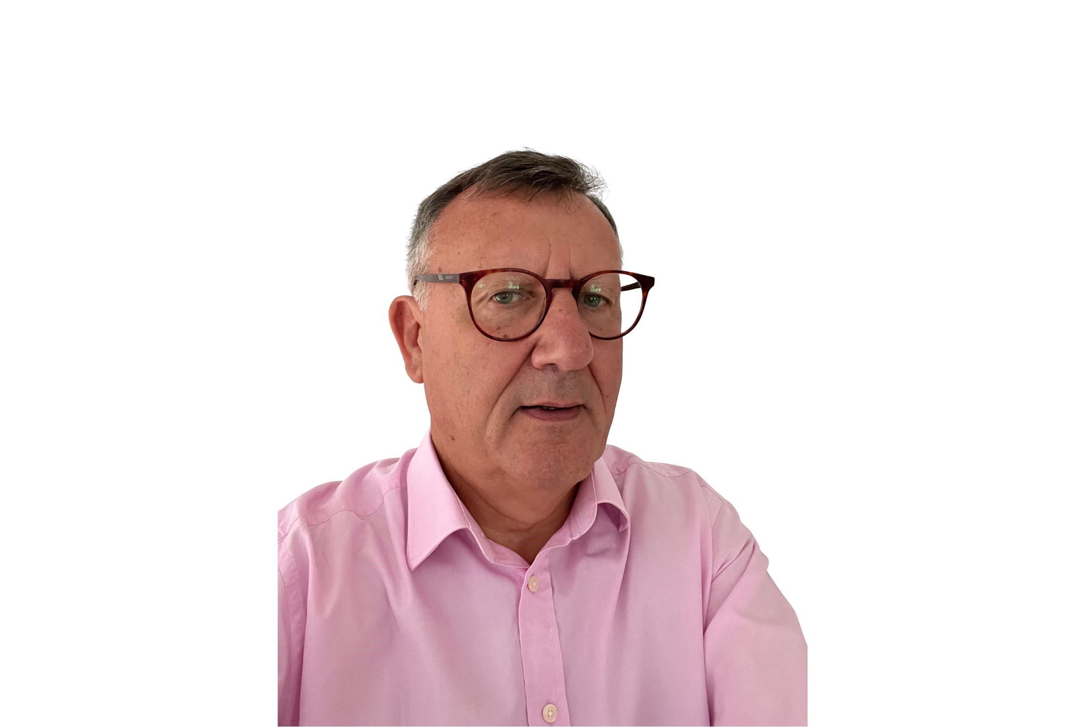 Headshot of Sir Andrew Morris, wearing glasses and a pink shirt against a plain white background
