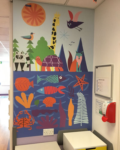 A sea creature mural in a nook behind a ward cupboard