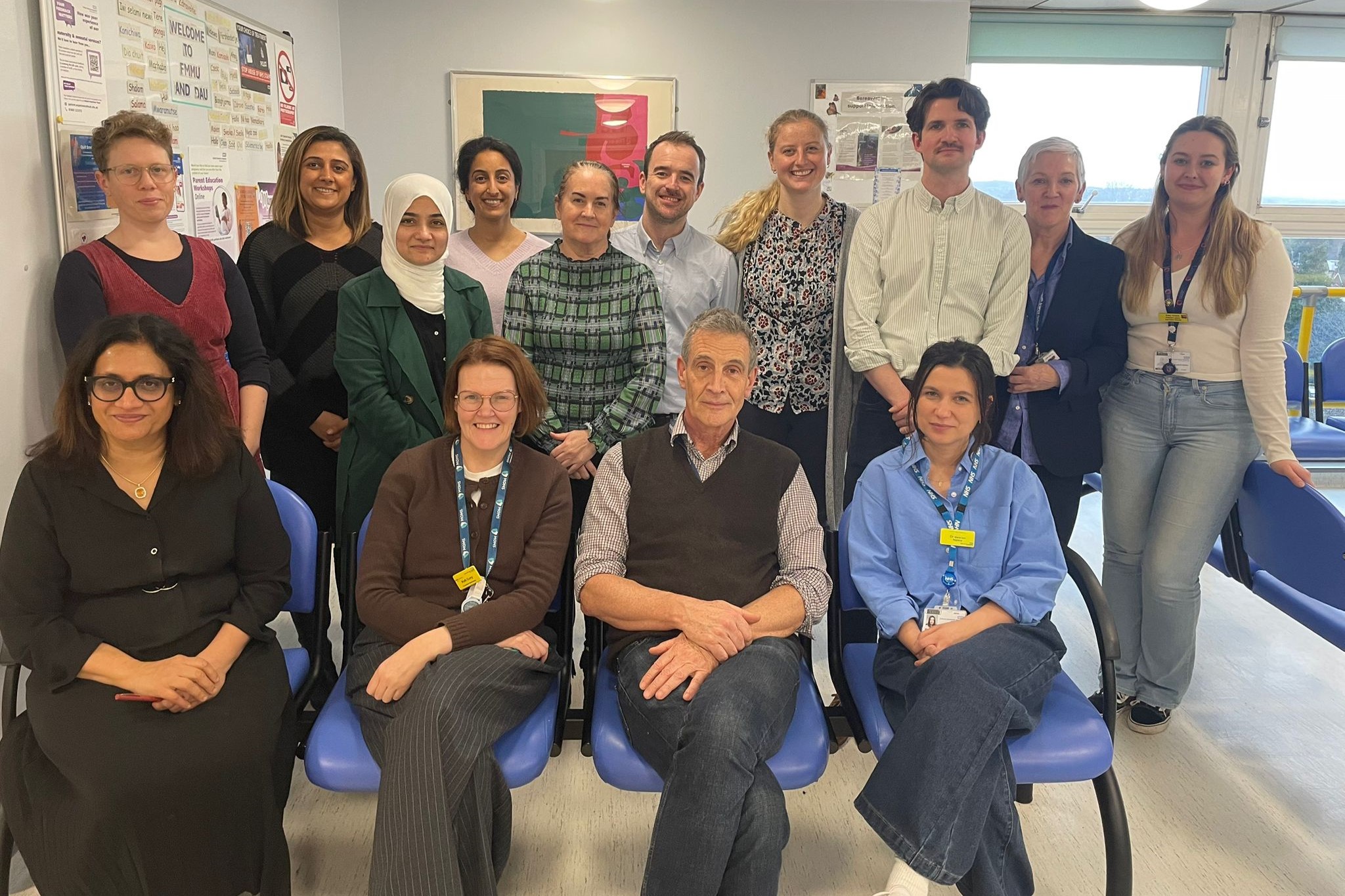 Group photo of healthcare staff together in a clinic room