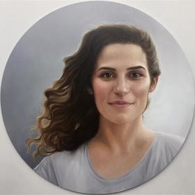 Circular painting of person with long hair