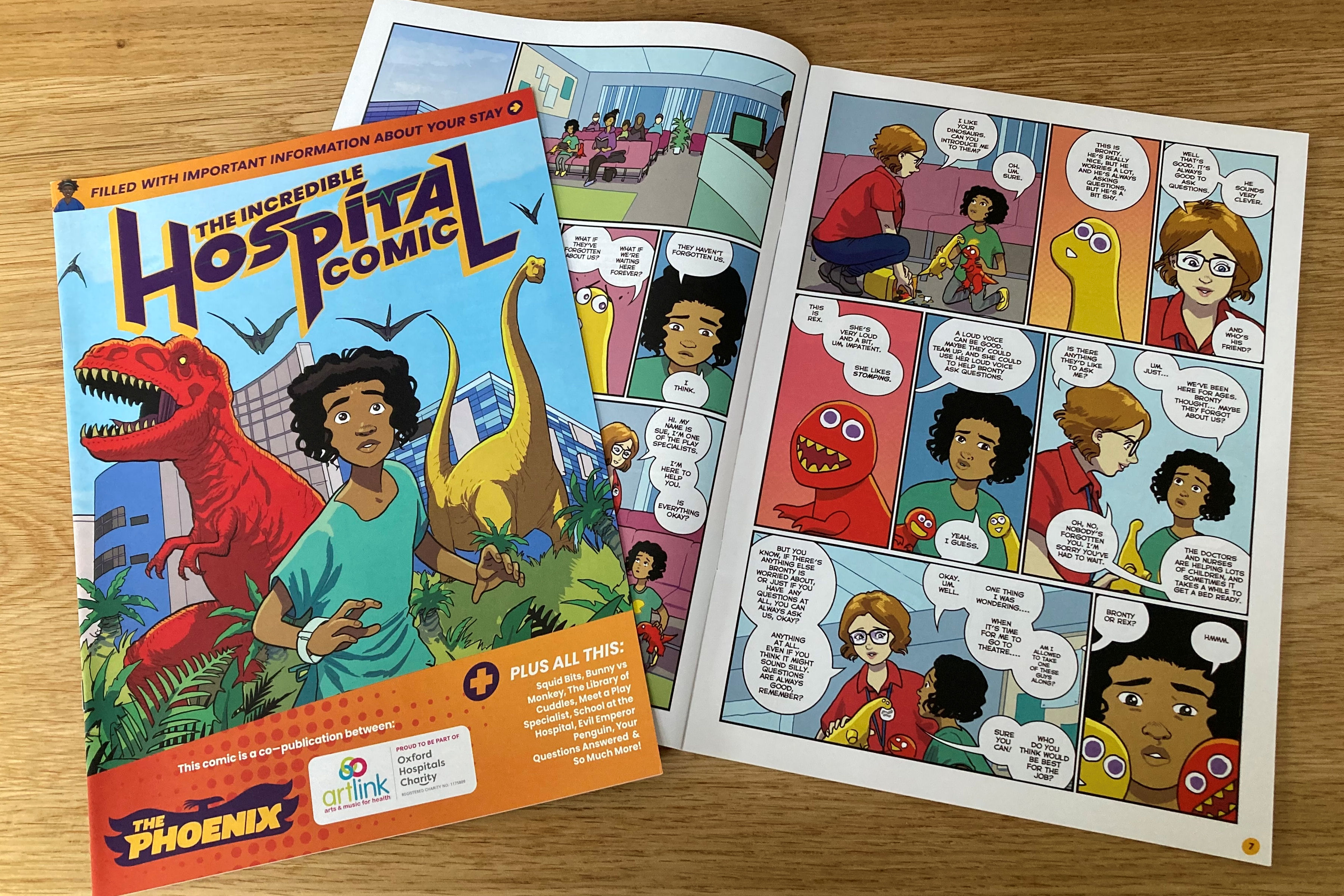 Double page spread and cover of 'The Incredible Hospital Comic' with running boy and two dinosaurs.