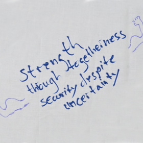 'Strength through togetherness security despite uncertainty' written with doodles of muscly arms either side.