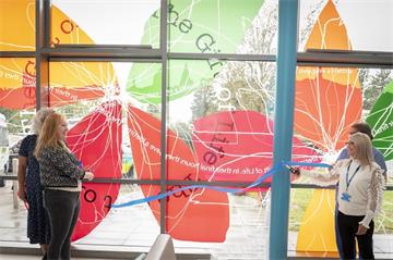 Sarah Cameron, L, and Teresa Saunders, R, cut the ribbon to unveil 'The Gift of Life'