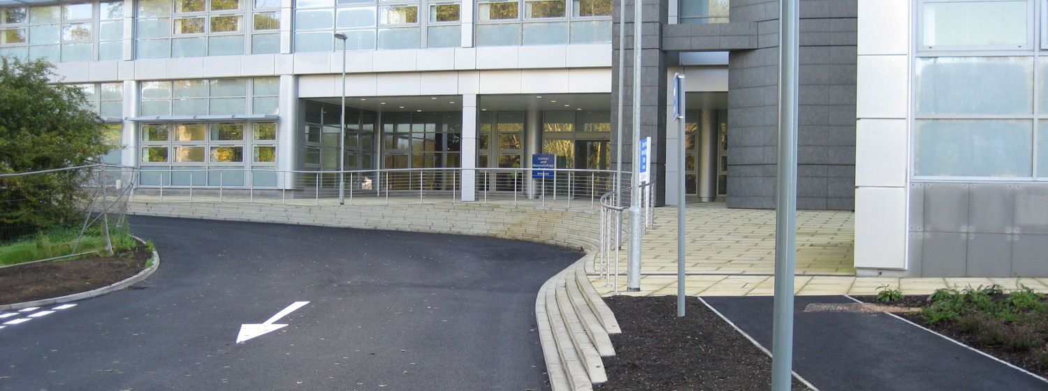 Entrance road to Churchill Hospital with building behind